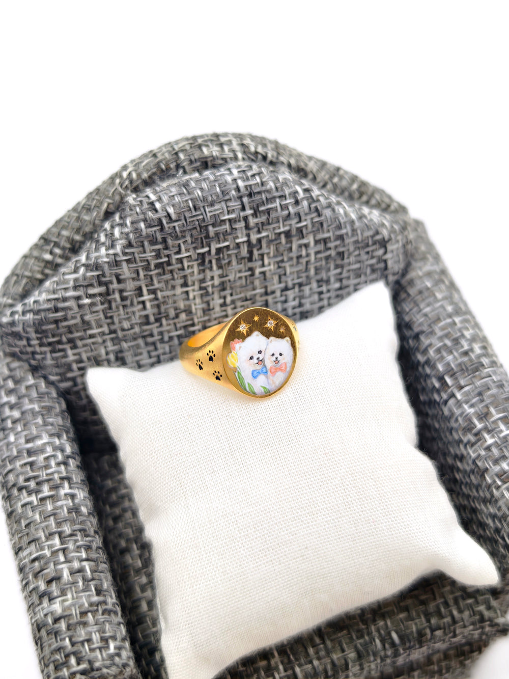 An enamel miniature pendant of a hand-painted dog
