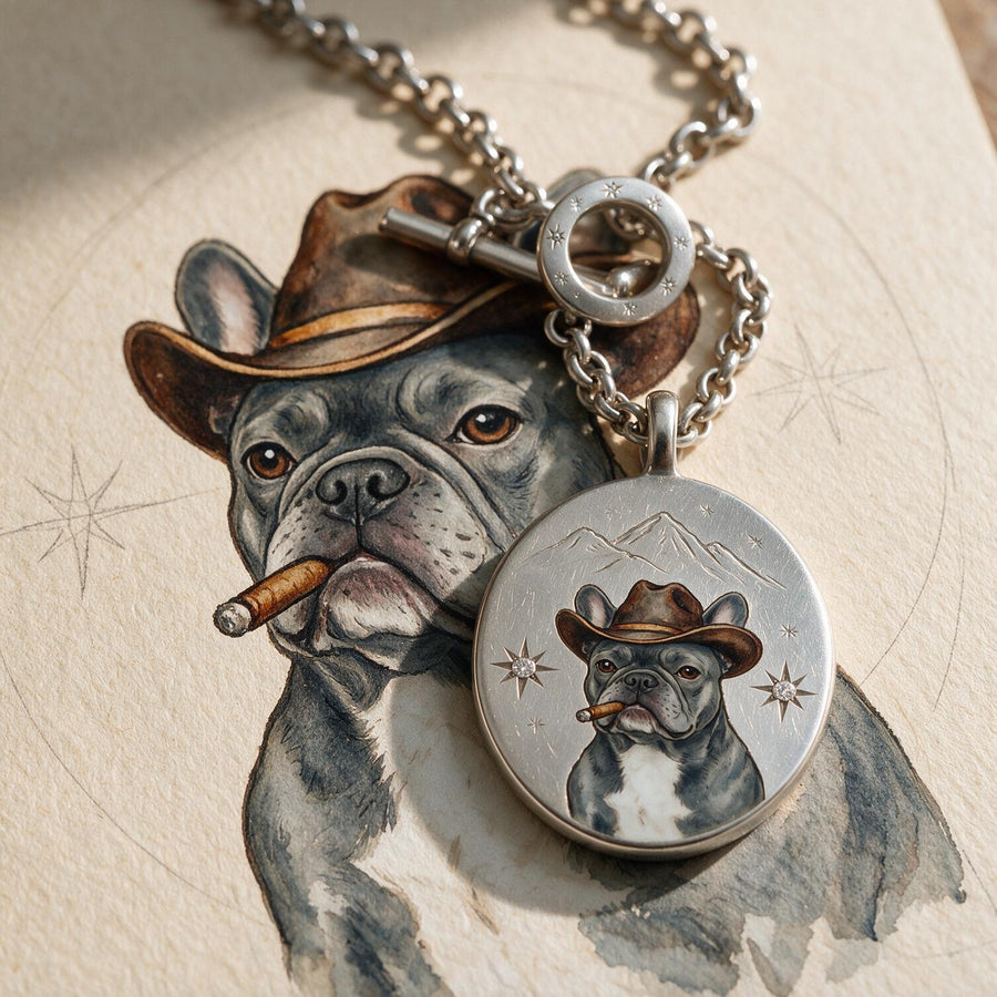 A silver enamel miniature pendant with a hand-painted portrait