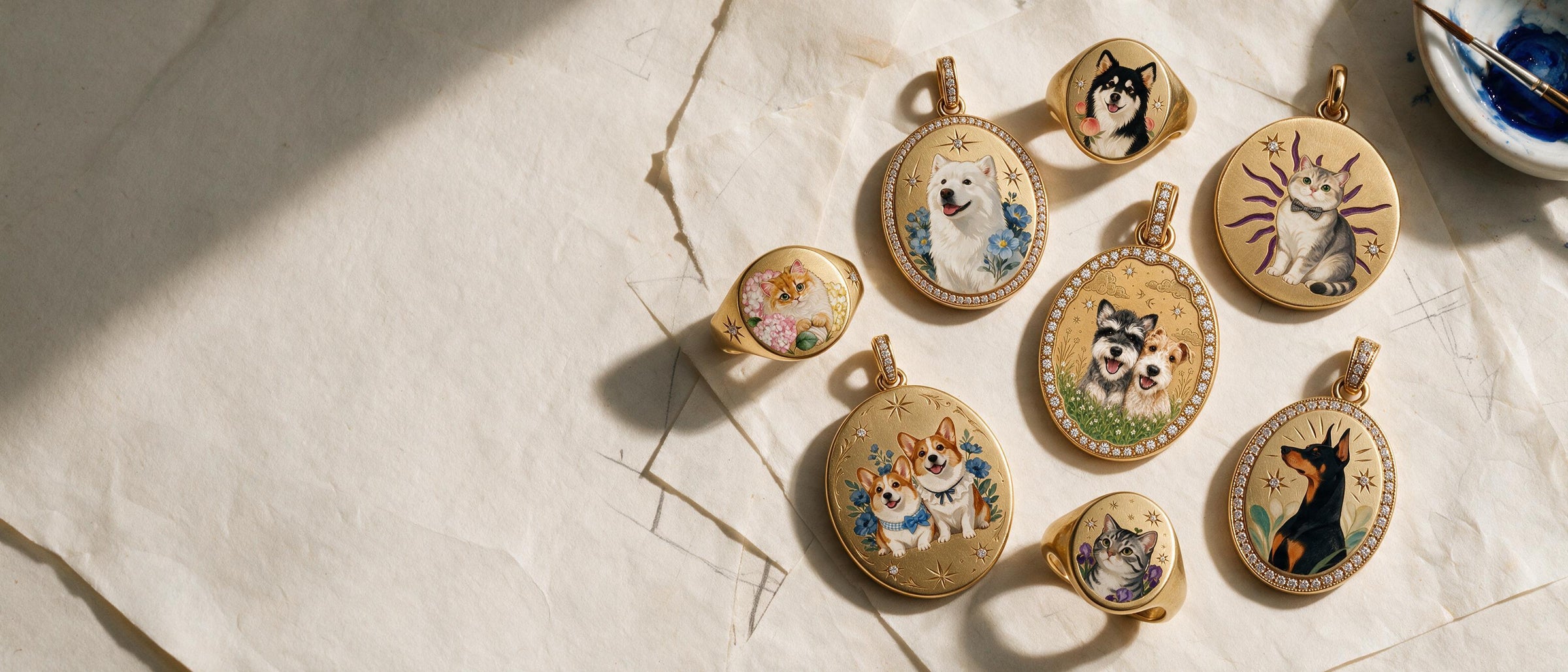 A hand-painted enamel miniature pendant beside the dog it was painted from