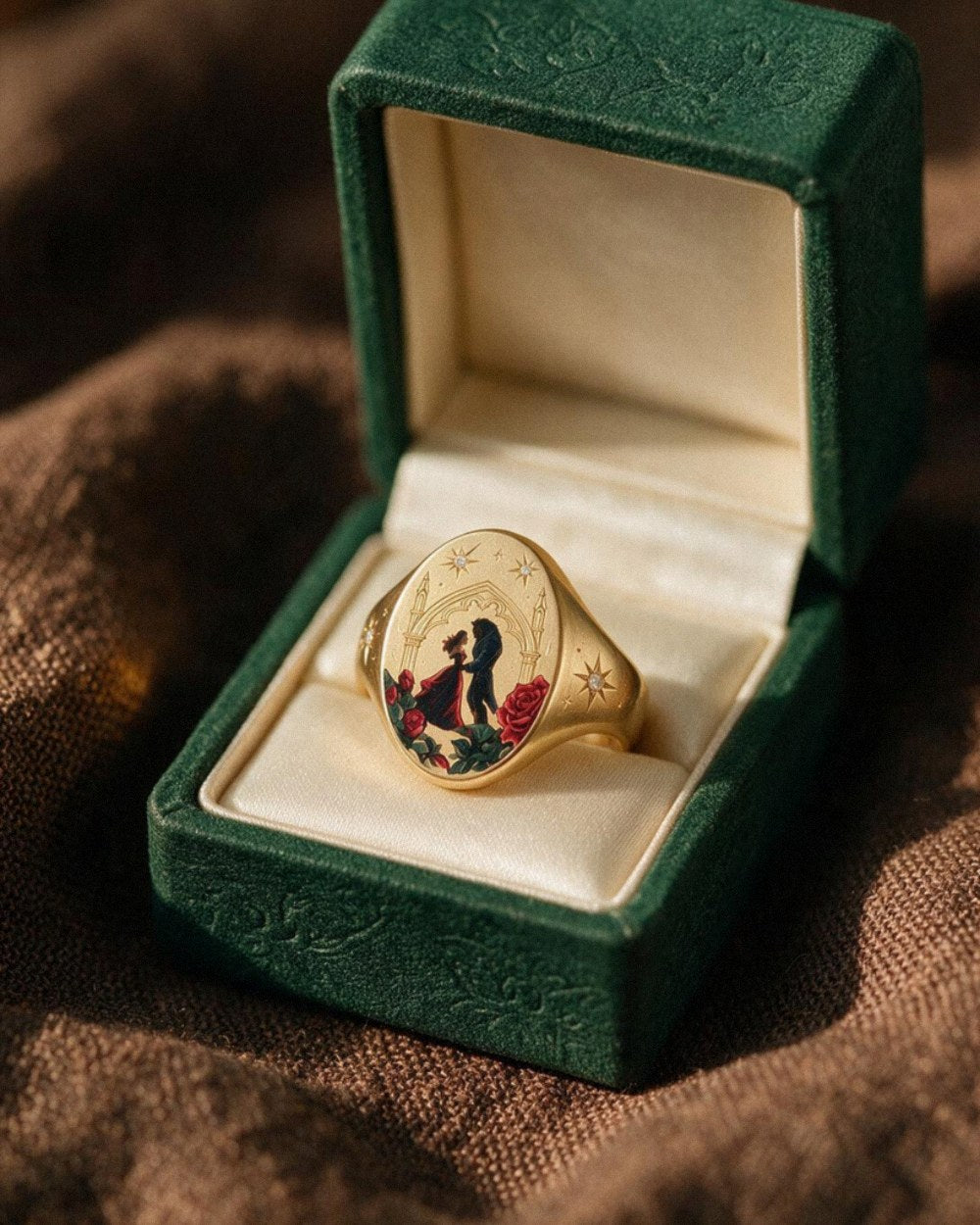 A solid 18K gold signet ring with hand-painted enamel