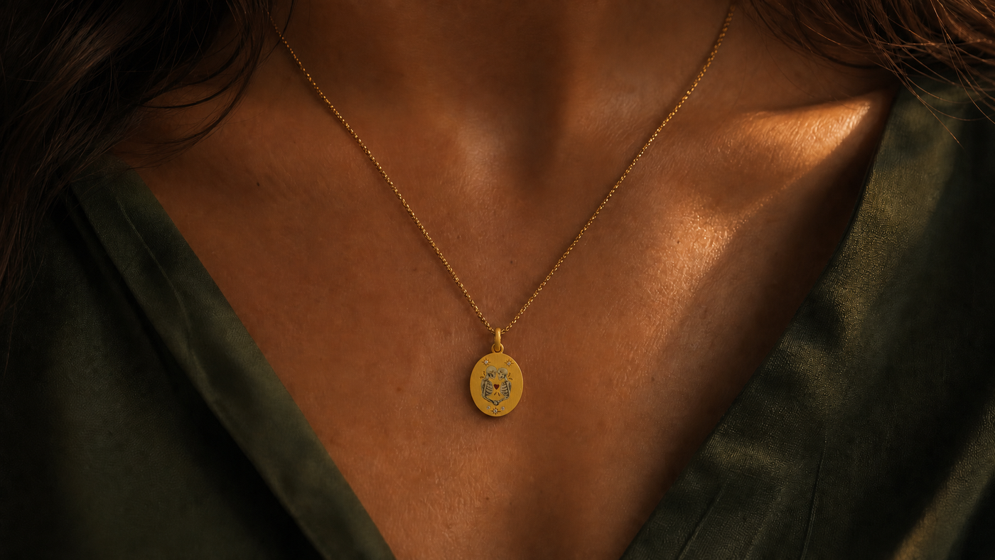 A Peace Piece Elysian hand-painted enamel pendant worn at the collarbone...