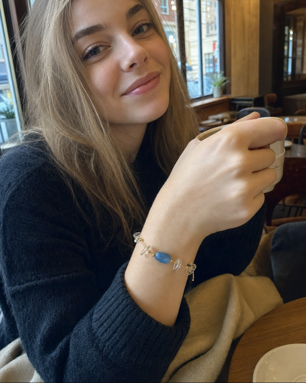 A stack of Peace Piece Seren natural-stone bracelets layered on the wrist