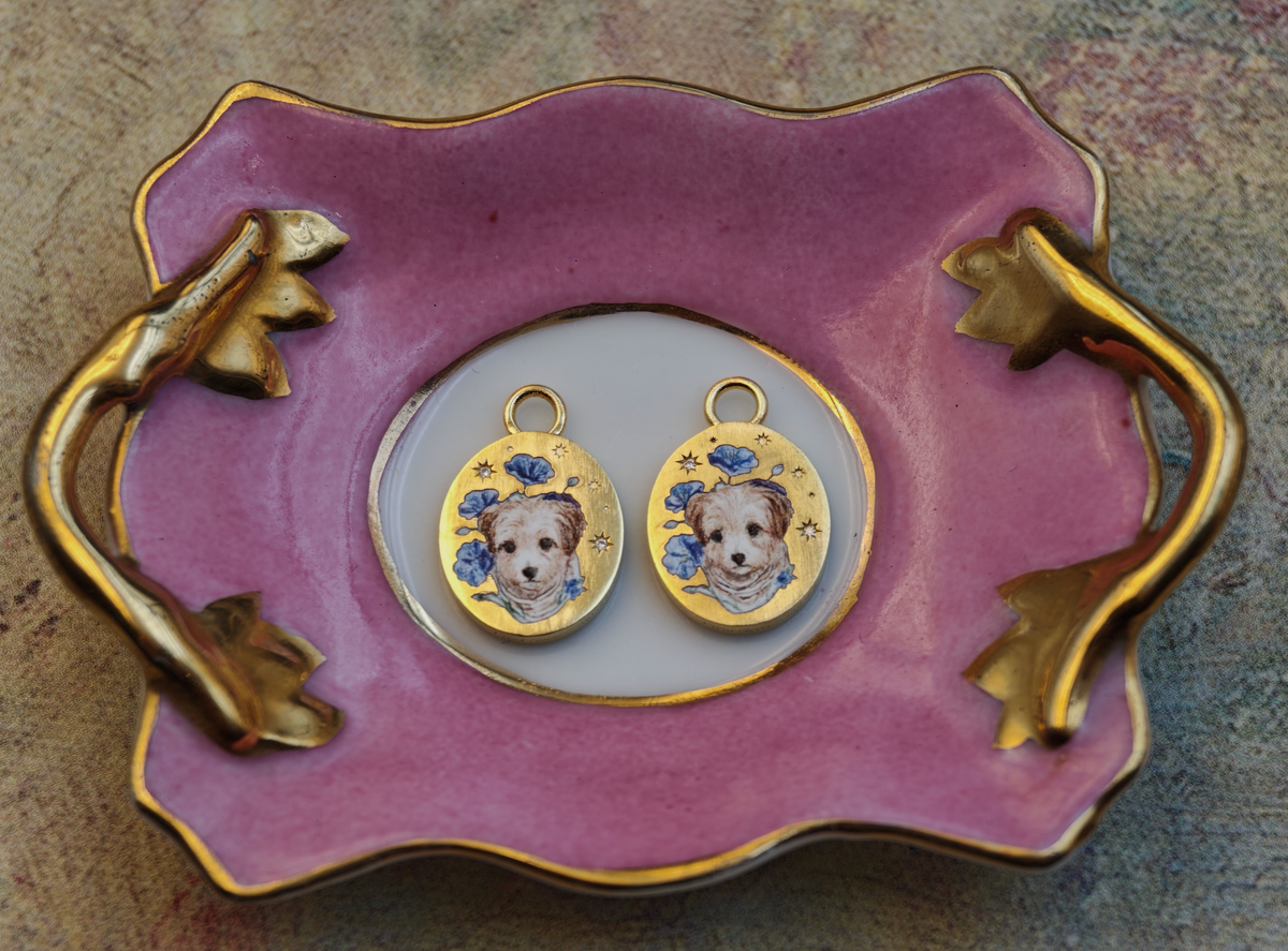 Two finished pieces painted from one identical design, side by side