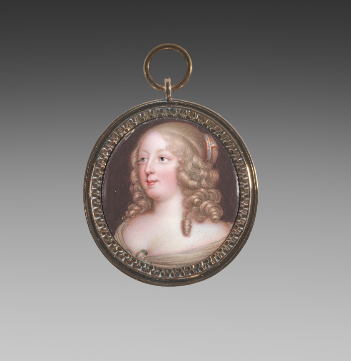 A hand-painted enamel miniature, photographed close enough to see the brushwork
